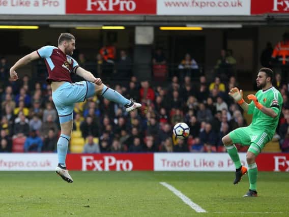 Sam Vokes volleys the Clarets level with his first touch after coming on as a sub