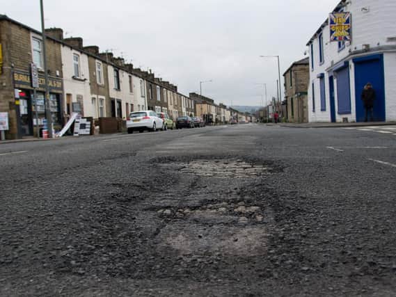 Lancashire County Council want to spent almost half their total road maintenance budget on fixing potholes across the county.