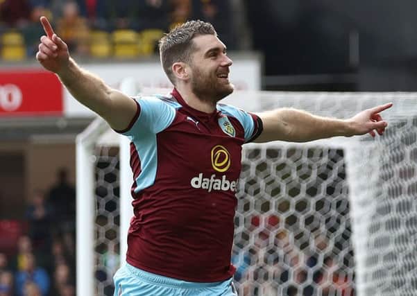 Burnley's Sam Vokes celebrates scoring his side's first goal of the game during the Premier League match at Vicarage Road, Watford. PRESS ASSOCIATION Photo. Picture date: Saturday April 7, 2018. See PA story SOCCER Watford. Photo credit should read: John Walton/PA Wire. RESTRICTIONS: EDITORIAL USE ONLY No use with unauthorised audio, video, data, fixture lists, club/league logos or "live" services. Online in-match use limited to 75 images, no video emulation. No use in betting, games or single club/league/player publications.