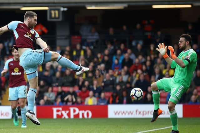 Burnley's Sam Vokes scores his side's first goal of the game during the Premier League match at Vicarage Road, Watford. PRESS ASSOCIATION Photo. Picture date: Saturday April 7, 2018. See PA story SOCCER Watford. Photo credit should read: John Walton/PA Wire. RESTRICTIONS: EDITORIAL USE ONLY No use with unauthorised audio, video, data, fixture lists, club/league logos or "live" services. Online in-match use limited to 75 images, no video emulation. No use in betting, games or single club/league/player publications.