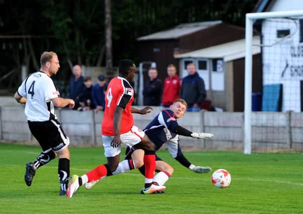 Bamber Bridge FC (white) v Morecambe FC (red). Daniel Agyai thwarted by keeper Marcus Burgess. Picture by Paul Heyes, Tuesday July 12, 2016.