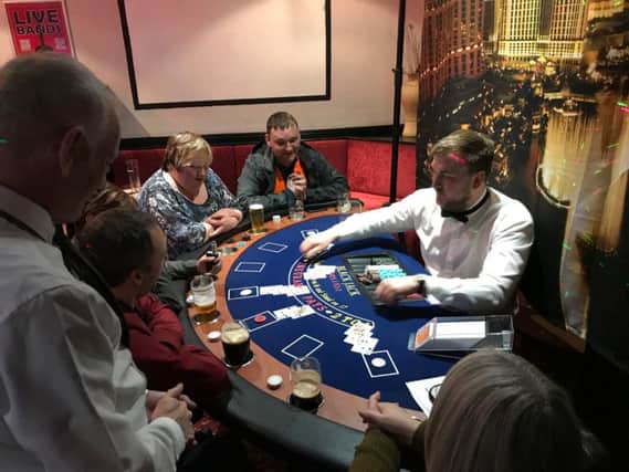 'Gamblers' enjoying a spot of blackjack at the Princess Royal charity casino night (s)