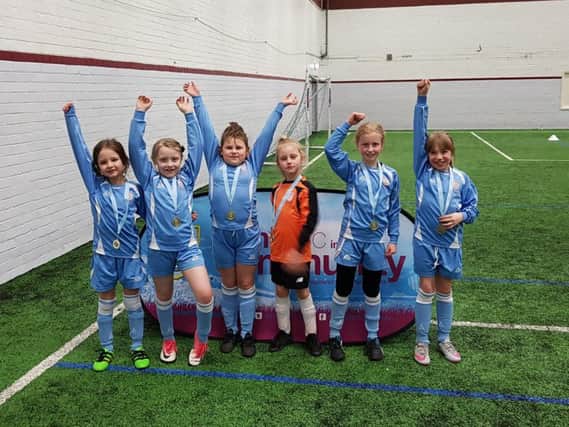 The victorious team from Burnley's Holy Trinity Primary School who are Darcey Carley, Megan Howarth, Lily Haythornwhite, Hollie Catlow, Eden Slater and Skye Heald.