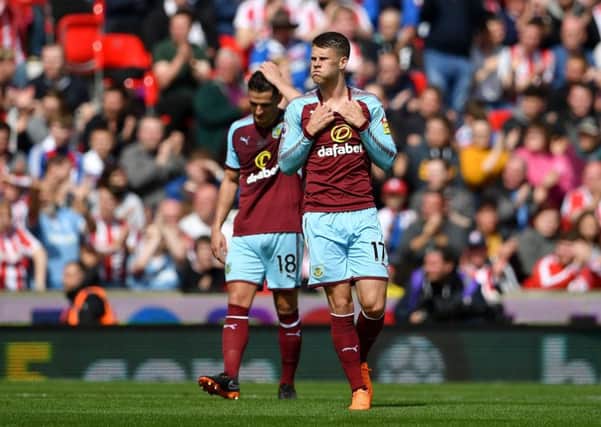 Burnley's Ashley Westwood (left) and Johann Berg Gudmundsson react during the Premier League match at the bet365 Stadium, Stoke. PRESS ASSOCIATION Photo. Picture date: Sunday April 22, 2018. See PA story SOCCER Stoke. Photo credit should read: Joe Giddens/PA Wire. RESTRICTIONS: EDITORIAL USE ONLY No use with unauthorised audio, video, data, fixture lists, club/league logos or "live" services. Online in-match use limited to 75 images, no video emulation. No use in betting, games or single club/league/player publications