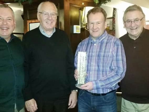 Chris Hogan (centre right) presenting the new Anniversary Trophy to President, Peter Shaw (centre left), watched by Chairman Phil Caine (right) and Mark Mercer (left).