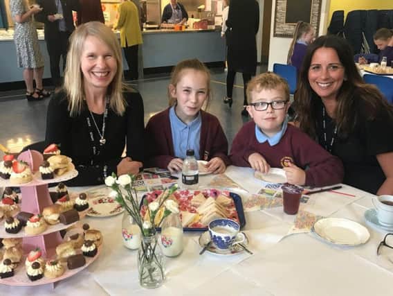 Eloise Dutton and Jonathan Rides, Year 5 pupils from Holy Trinity School with headteacher Mrs Sally Smith (left) and assistant head Alison Whitaker.