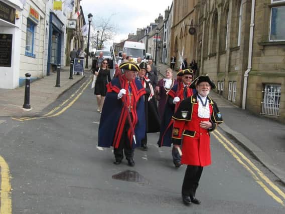 Town Crier Roland Hailwood leading the mayor making procession.