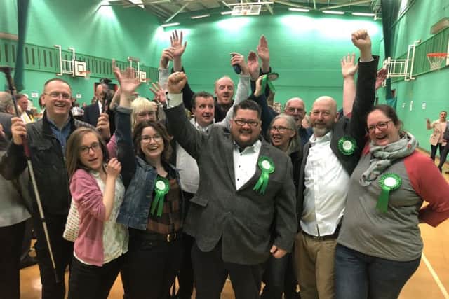 Andy and his team celebrate the Green Party's victory