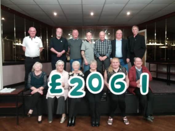 Committee members at Rosegrove Railway Club in Burnley raised 2,061 at a charity night for Macmillan Cancer Support