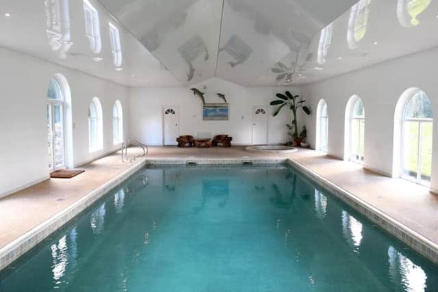 The home boasts a heated indoor swimming pool. (photo credit: Savills)