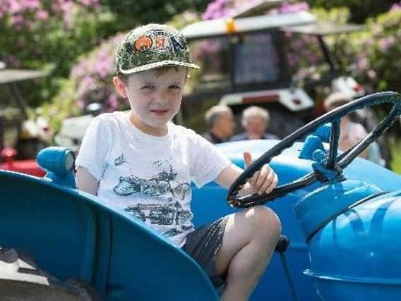 Frank Jackson enjoys a tractor ride at last year's Todmorden Agricultural Show.
