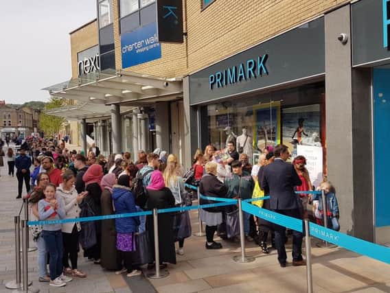 Eager shoppers wait for the opening of the new Primark store in Burnley