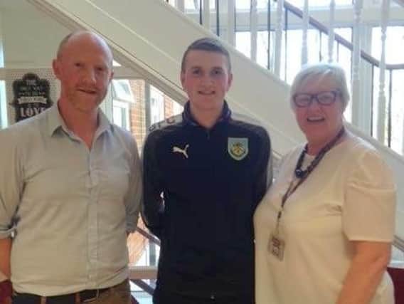Jayms Bell, Jordan Pilling and Alison Malcolm, both of Burnley FC in the Community