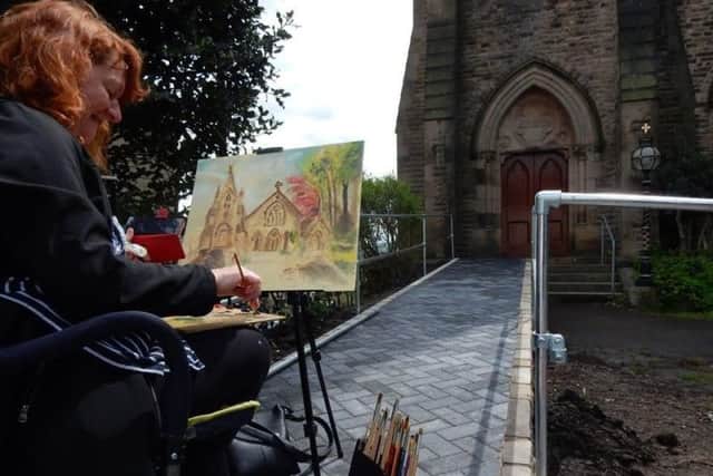An artist at work during the Painting Padiham competition
