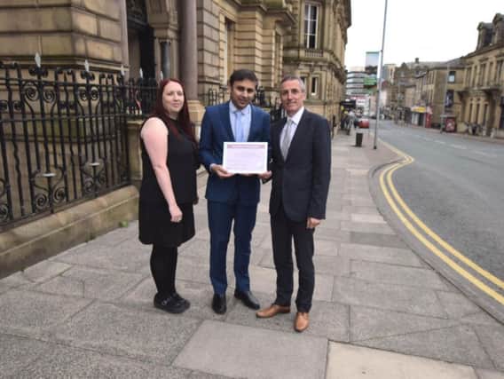 Jo Cudworth (far left) and Simon Westwell (far right) from Petty with Lukman Patel, Chief Operating Officer at Burnley Borough Council.