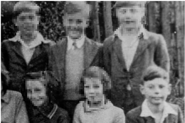 Peter as a young boy at the orphanage, pictured on the front row, far right.