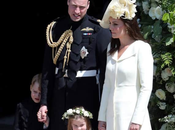 Prince George (far left) with his sister Princess Charlotte (centre) and their parents, Prince William and Kate the Duchess of Cambridge.