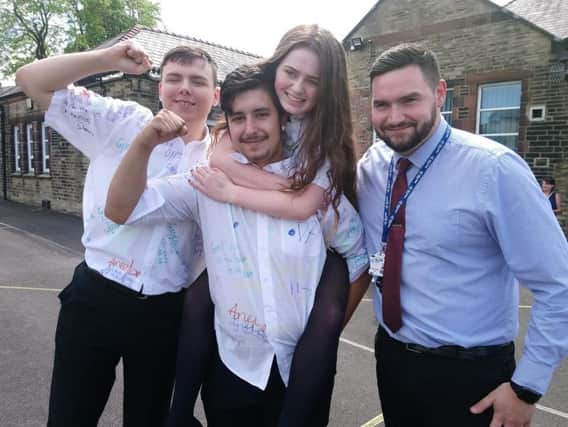 Kara with two of her classmates and Chris Whittaker (right), the school's Assistant Headteacher.