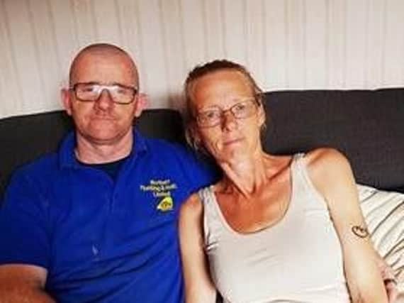 Plumber James Anderson, with his wife Barbara, has vowed to continue helping people who need him, despite recent setbacks.