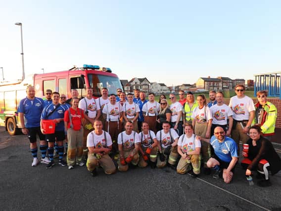 Laura and Andy and the firefighters and their support team who took part in the sponsored seven-and-a-half-mile fire engine pull.