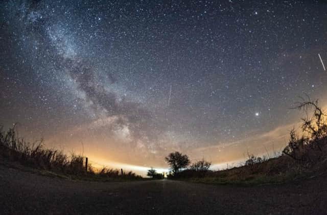 The milky way and meteors of the April Lyrids annual meteor shower (Photo: Daniel Reinhardt/AFP/Getty Images)